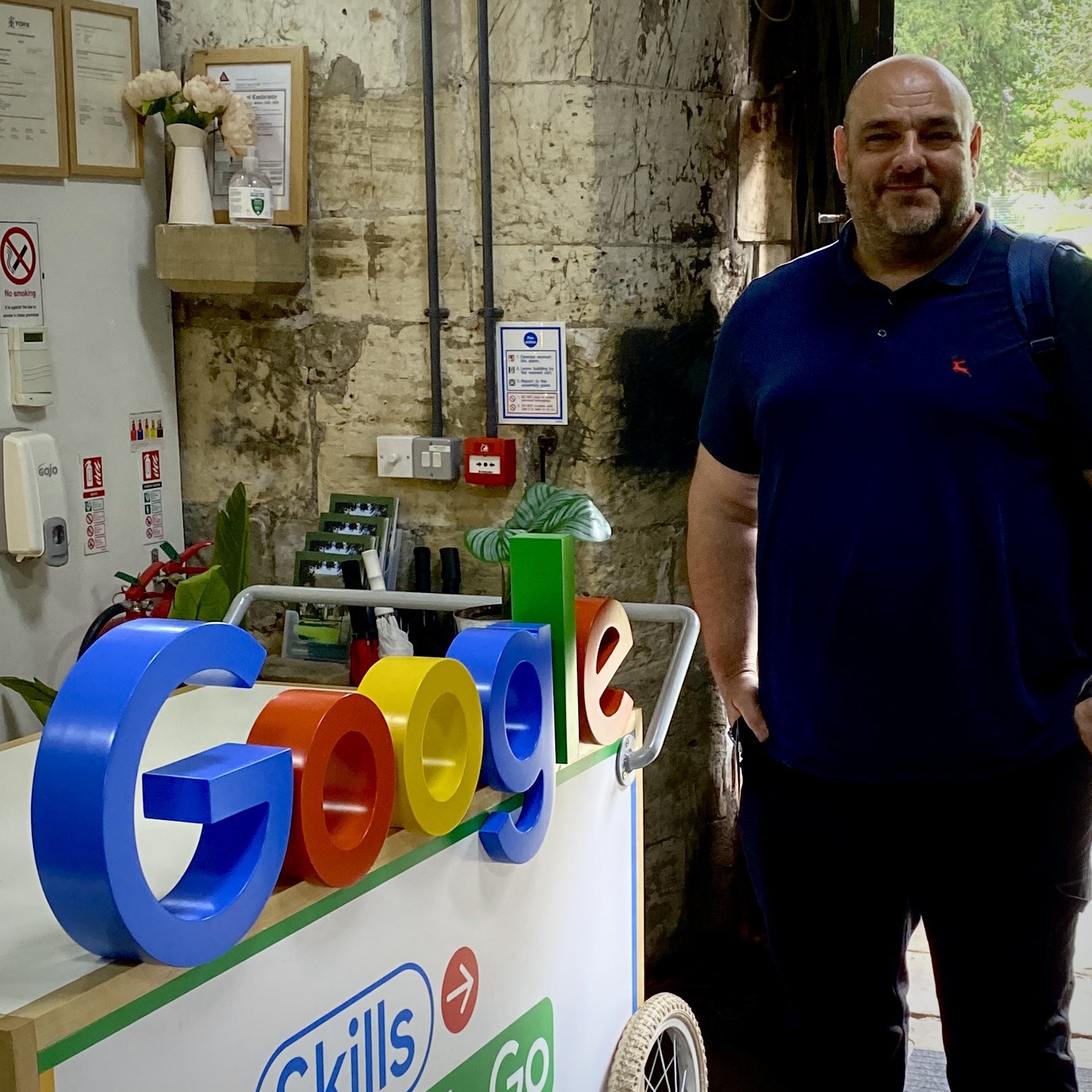 Craig pickles stood in front of the google logo